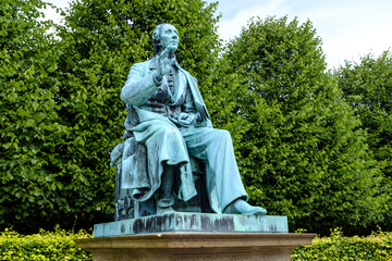 Obraz premium Denmark - Zealand region - Copenhagen city center - royal King’s Garden Kondens Have park and a statue of the writer Hans Christian Andersen