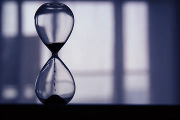 Hourglass as time passing concept for business deadline.