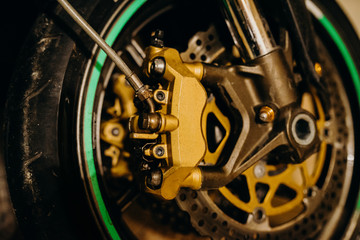 Fototapeta na wymiar Rear chain and sprocket of motorcycle wheel. Technical elements. Race. Moto Kit