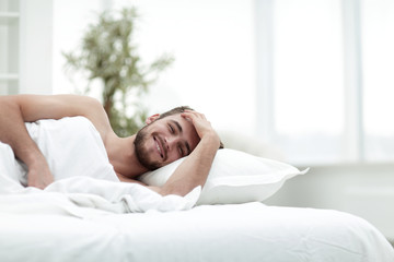 Fototapeta na wymiar business man resting in a comfortable hotel room