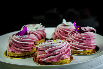 pink zephyr cookies on white plate