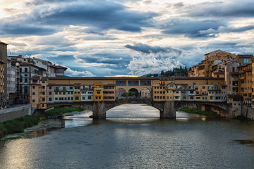 Fototapeta na wymiar View of Gold (Ponte Vecchio) Bridge in sunrise, Florence