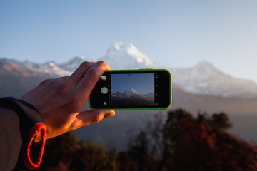 A man hands holding mobile take photo holding smartphone taking photo at mountain view. - 193597278