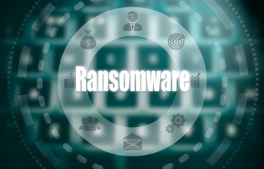 Selecting a Ransomware business concept on a futuristic portable computer screen.