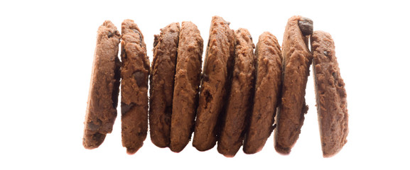 several pieces of cooky in strange pile on white background