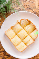 toast bread bake with honey on the plate
