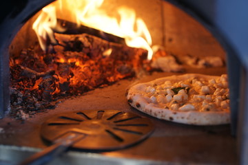 Neapolitan pizza in a wood stove