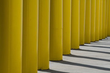 Abstract yellow poles and shadows