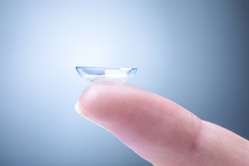 Contact Lens on a Man's Index Finger