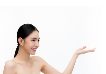 Young beauty Asian face, beautiful woman showing empty hand isolated over white background. Healthcare and Skincare concept.