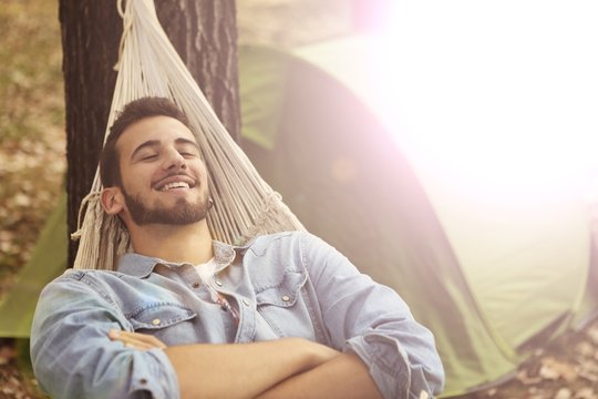 Relaxed Man Lying In A Hammock