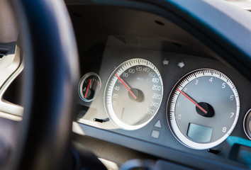 Front panel of car with speedometer and tachometer