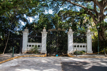 Photo of old entrance gate of deserted park, now a zoo in San José, Costa Rica