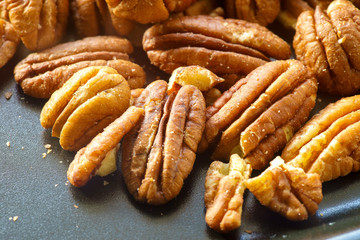 Pecans nuts. A close-up photograph. Unrefined whole kernel