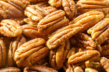 Pecans nuts. A close-up photograph. Unrefined whole kernel