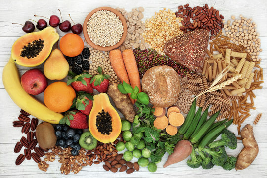 Food with high fibre content for a healthy diet with fruit, vegetables, whole wheat bread, pasta, nuts, legumes, grains and cereals. High in antioxidants, anthocyanins and omega 3 fatty acid.
