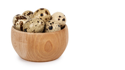 Healthy fresh organic quail eggs in wooden jar. Isolated on white background. Protein reserve. Copy space