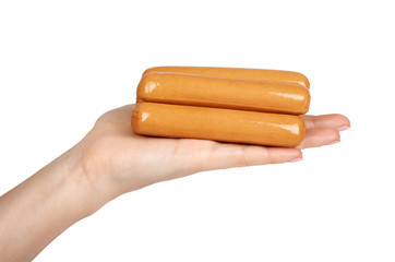 Meat sausage for hot dog or barbecue in hand. Isolated on white background. Fast food meal