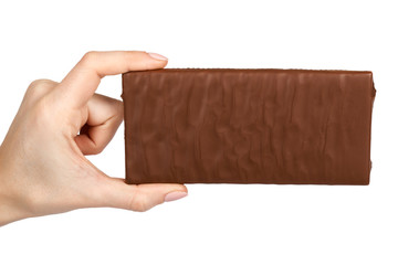 Chocolate plate with filling in hand. Isolated on a white background. Sweet and tasty food