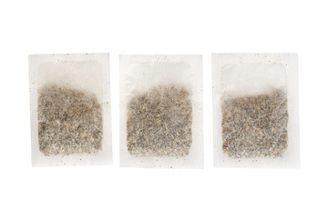 Tea in paper bag. Isolated on white background. Herbal teabag