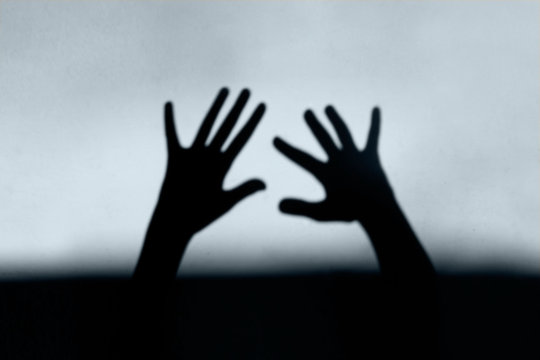 Abstract Background. Black Shadow Of A Big Hand On The Wall. Silhouette Of A Hand On The Wall. Nightmares in Children. Scary Dreams.
