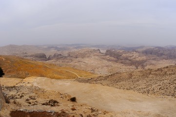 pastel desert landscape / Landscape of sun burnt mountains is taken on the way from Aqaba to Petra, Jordan