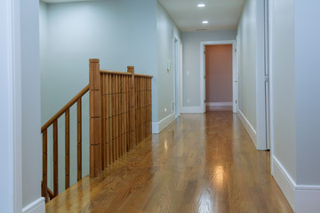 view of wooden glossy stairs from upword showing a beautiful scenery hunged