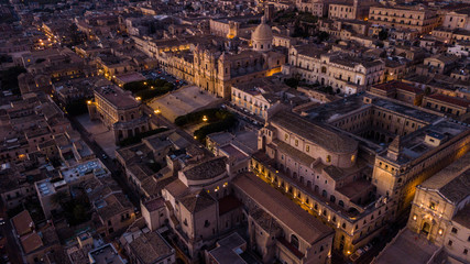 City of Noto in Sicily Italy aerial picture from above with drone light in the dark buildings and...