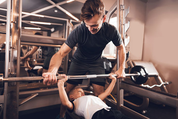 Father and son in the gym. Father and son spend time together and lead a healthy lifestyle.