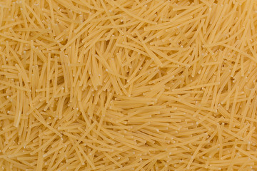 Raw fusilli pasta from durum wheat. Food background.