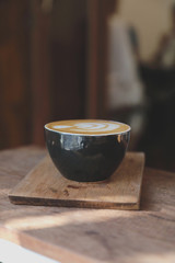 Cappuccino coffee break on wood background