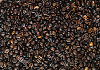 Roasted coffee beans as background. Top view.