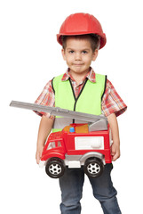 child in a red helmet and with a fire engine in his hands