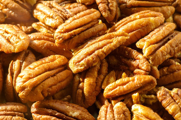 Pecans nuts. A close-up photograph. Unrefined whole kernel