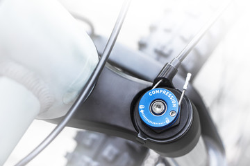  Mountain bike wheel, shock absorber and gear detail, close up shot of top cap of mountainbike...