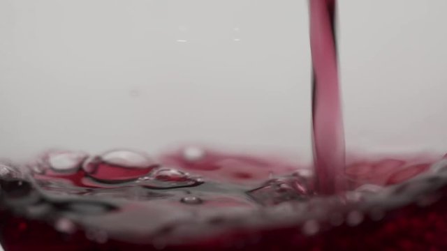 Macro shot of Cabernet Sauvignon being poured in slow motion. Passion style footage of Easter scenes
