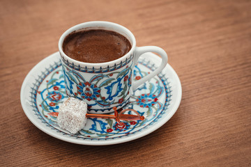 traditional turkish coffee served with porcelain chinaware cup and turkish delight