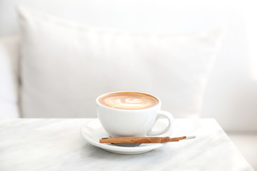 cappuccino or Latte art coffee made from milk on the white table in coffee shop