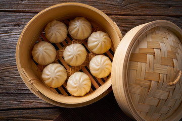 steamed pork buns in bamboo steamer