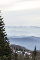 mountain hills with fog in the distance