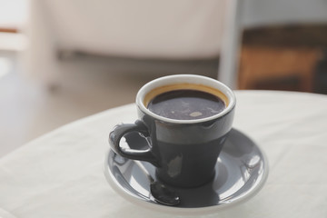 Coffee cup in white table