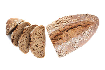 a loaf of unleavened bread with sunflower seeds close-up on a white background