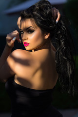 Fototapeta premium Portrait of beautiful girl with an evening make-up, close-up