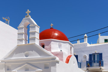 Typical Greek church building with red dome in Mykonos town. Cyclades islands, Greece © vivoo