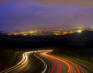 Fototapeta na wymiar Car lights going to the city at night