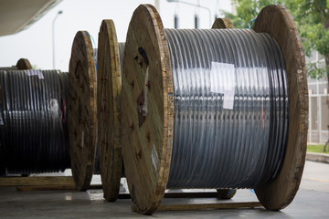 Rolls of high-voltage power cable on floor