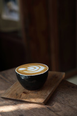 Cappuccino coffee break on wood background
