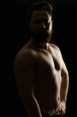 Fototapeta na wymiar shirtless, handsome young man standing. Studio shot of light,