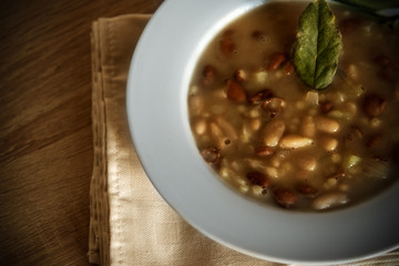 Bay leaf on a fregola and beans soup