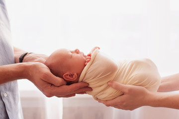 newborn baby in  hands